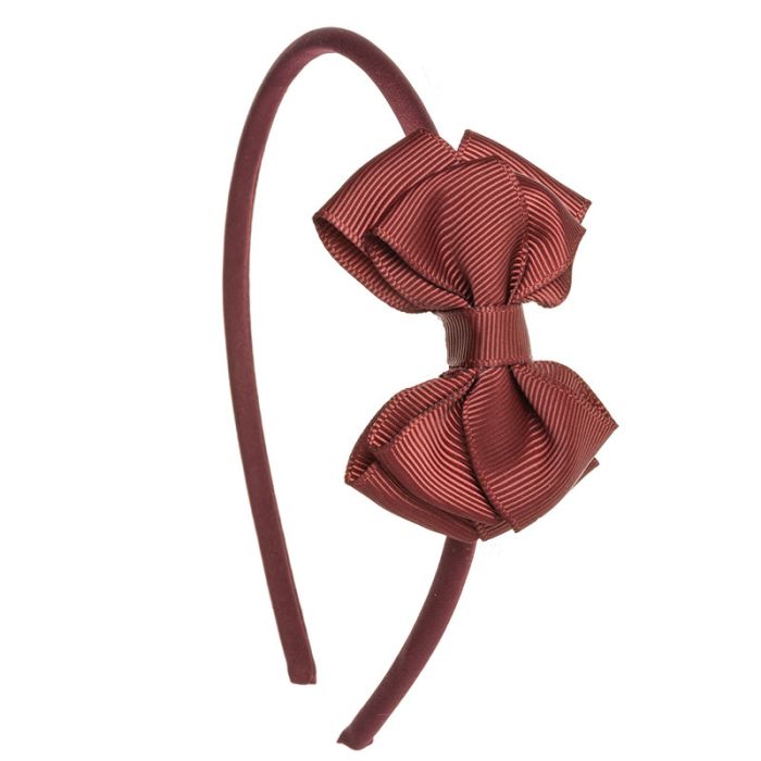 Cerchietto per bambina con fiocco in gros grain a
forma di farfalla